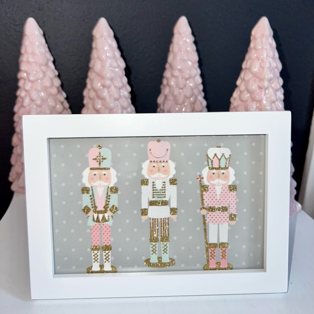 Pink pastel nutcracker picture in white frame
